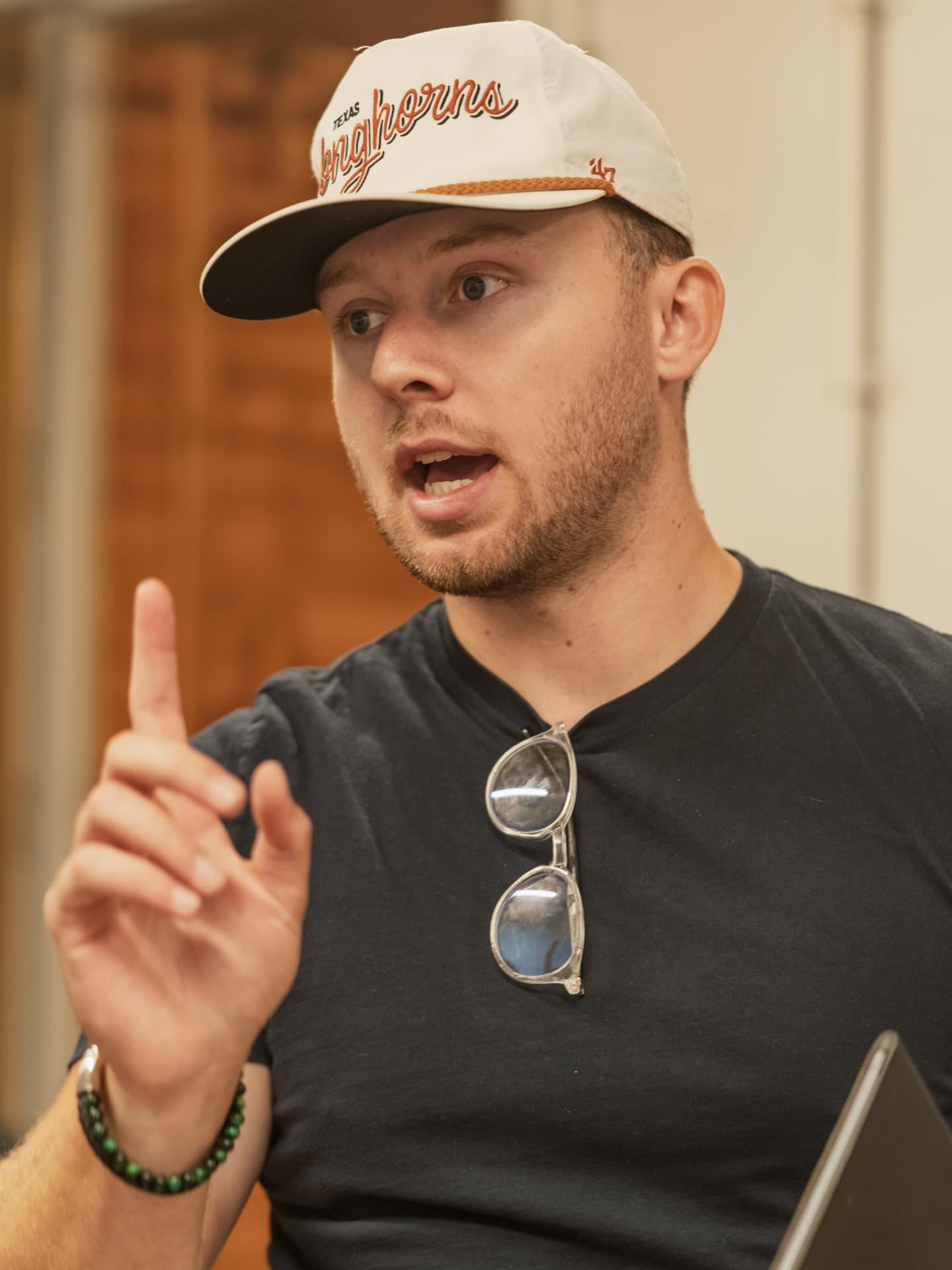 Producer talking through a run-of-day with the crew before recording